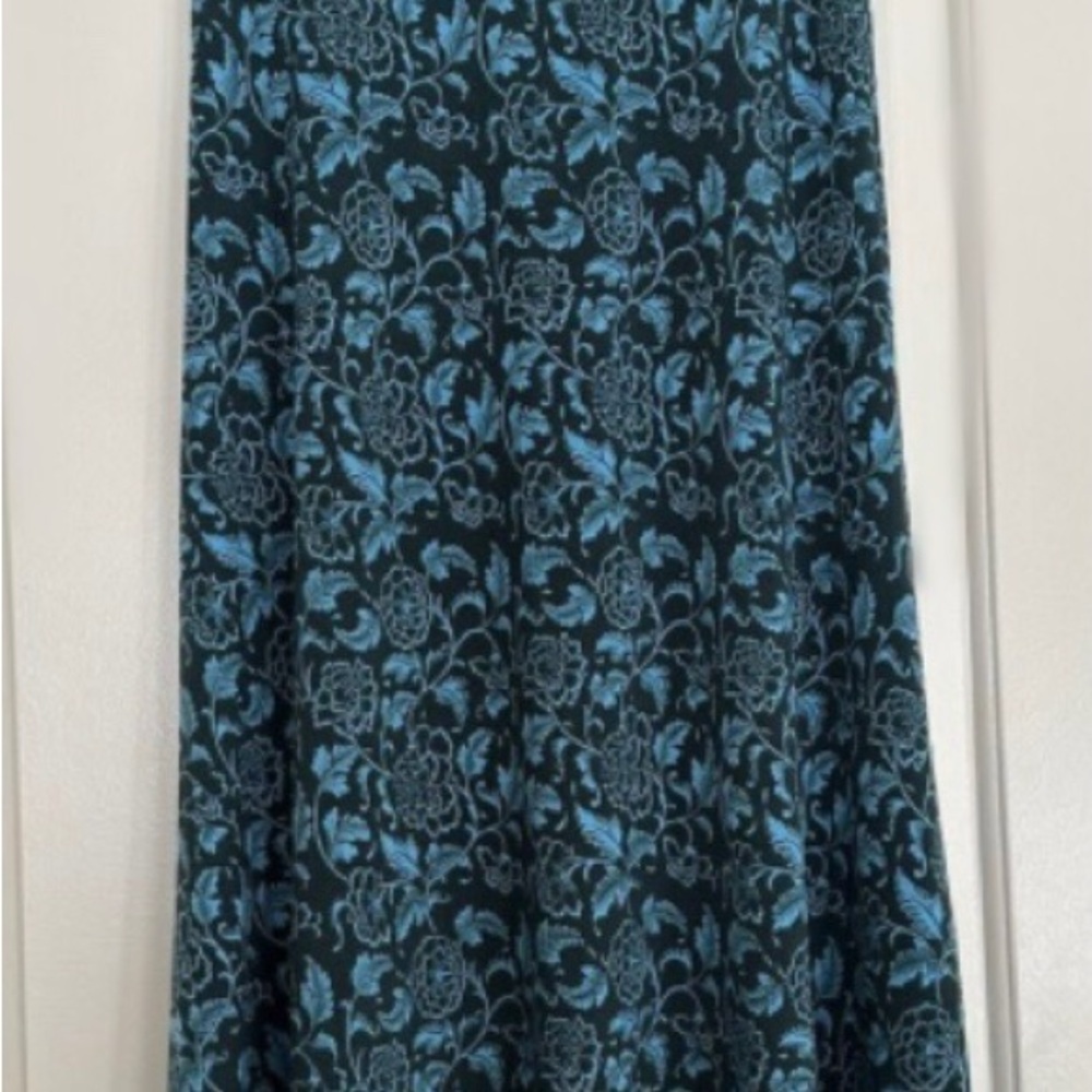 LuLaRoe maxi skirt new without tags never worn.   Teal blue/green floral black.